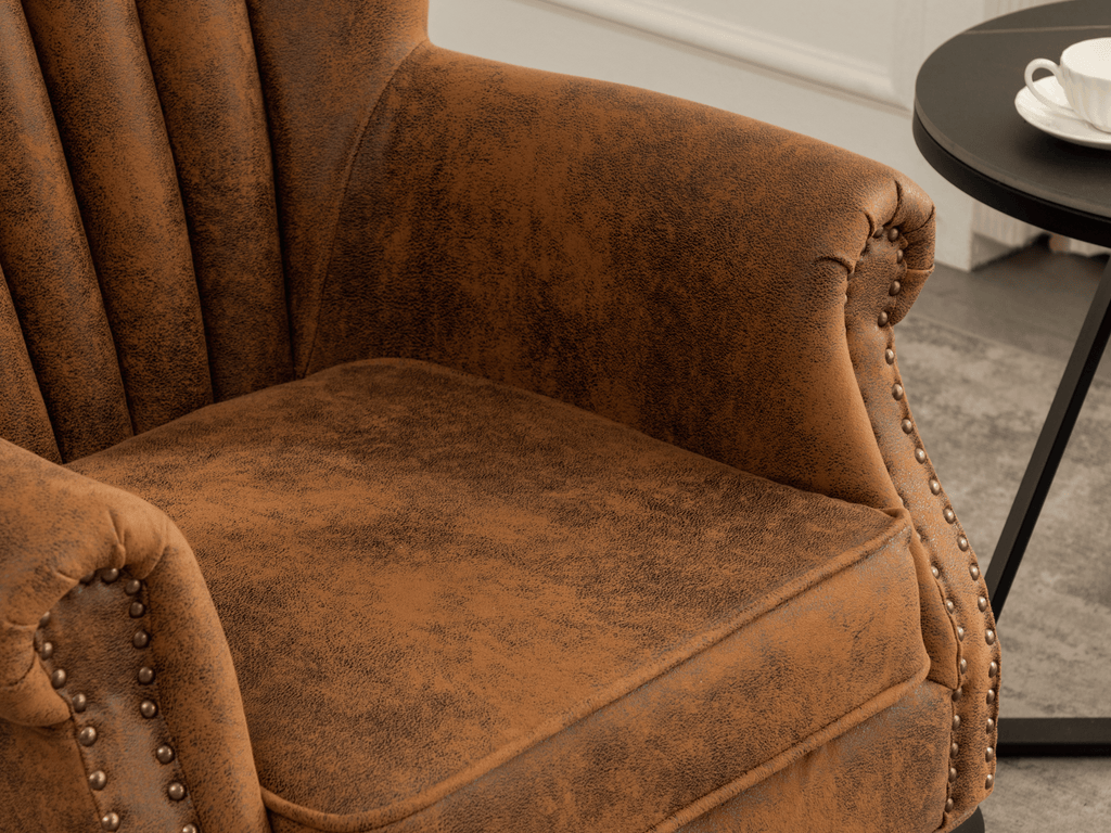 A closeup on a Jemma Suede Leather Air Brown chair from Stunning chairs, with a side table and a white coffee cup in the background.