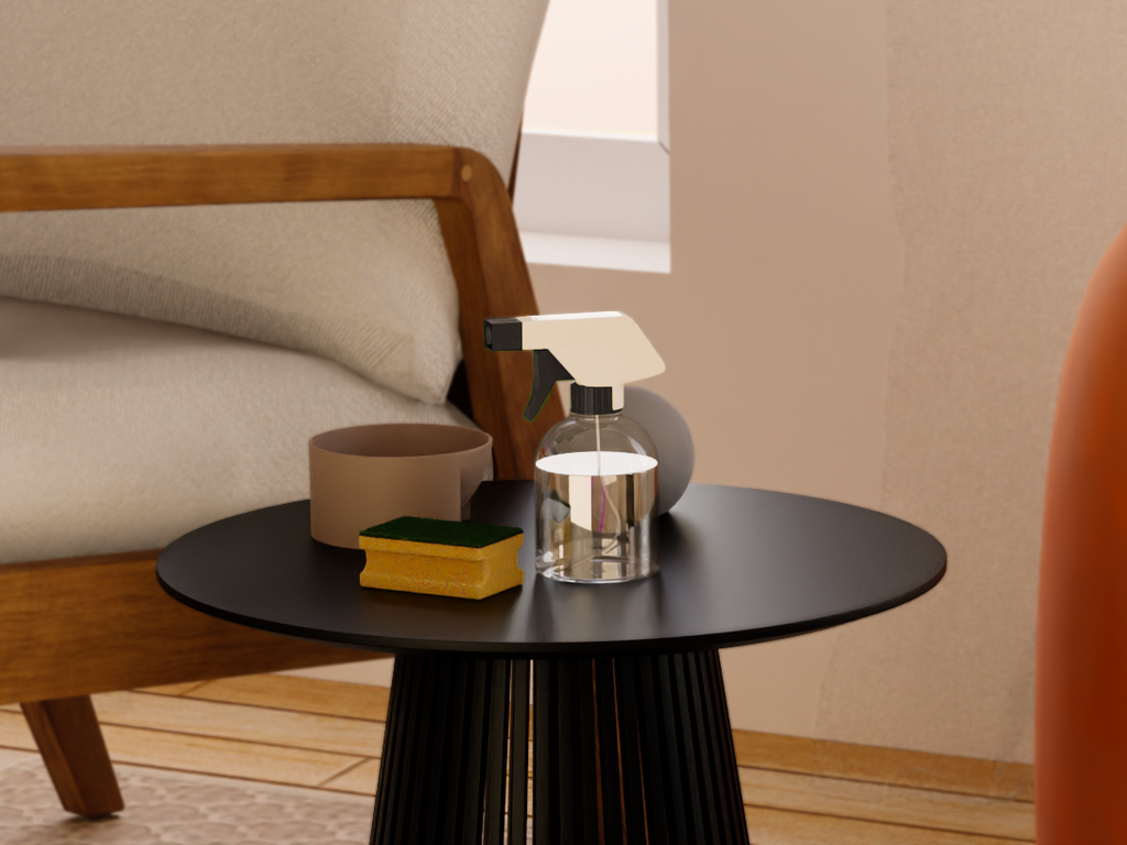 A cleaning spray bottle and a cleaning sponge next to an upholstered cotton beige accent chair.