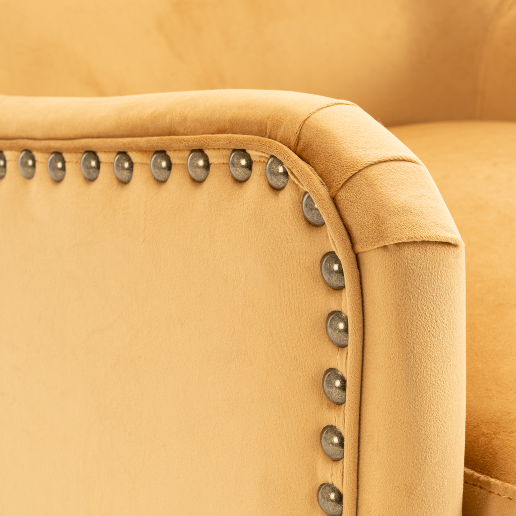 Velvet Gold Segovia Accent Chair closeup armrest with decorative studs